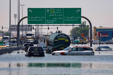 Cars are stranded in flood water on a blocked highway following heavy rainfall, in Dubai, United Arab Emirates, April 19, 2024.
