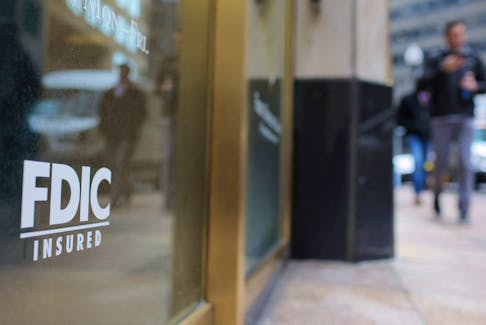 A sign reads “FDIC Insured” on the door of a branch of First Republic Bank in Boston, Massachusetts, U.S., March 13, 2023.