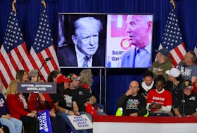 Pictures of U.S. President Joe Biden and Republican presidential candidate and former U.S. President Donald Trump are seen on a screen during a campaign rally for Trump in Green Bay, Wisconsin, U.S., April 2, 2024. 