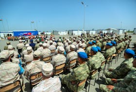 Service members attend a ceremony closing the Turkish-Russian Joint Monitoring Centre in the course of peacekeeping troops' withdrawal from the territory of Karabakh region and areas nearby, in Aghdam District, Azerbaijan, April 26, 2024.