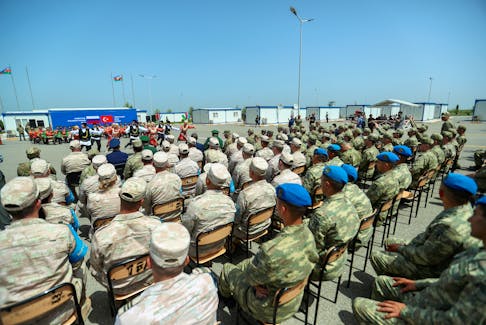Service members attend a ceremony closing the Turkish-Russian Joint Monitoring Centre in the course of peacekeeping troops' withdrawal from the territory of Karabakh region and areas nearby, in Aghdam District, Azerbaijan, April 26, 2024.