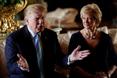 U.S. President Donald Trump talks to reporters as Linda McMahon, the outgoing Administrator of the Small Business Administration, sits beside him after announcing her resignation, at Trump's Mar-a-Lago estate in Palm Beach, Florida, U.S., March 29, 2019.