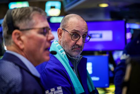 Traders work on the floor at the New York Stock Exchange (NYSE) in New York City, U.S., April 25, 2024.