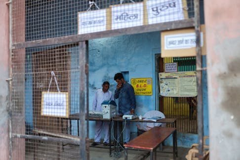 Election officials check the VVPAT machines during the second phase of the general election in Vrindavan, in the northern Indian state of Uttar Pradesh, India, April 26, 2024.