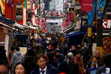 People are seen at a market street in Tokyo, Japan, January 23, 2017. Picture taken on January 23, 2017.