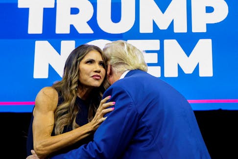 South Dakota Governor Kristi Noem greets former U.S. President and Republican presidential candidate Donald Trump before he speaks at a South Dakota Republican party rally in Rapid City, South Dakota, U.S. September 8, 2023.