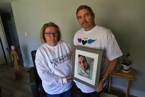Michele and Brian Haire hold a photo of their late son, Cameron, in their Lower Sackville, NS Tuesday April 23, 2024. Cameron took his life last year at the age of 26. 

TIM KROCHAK PHOTO