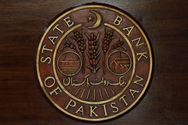 A logo of the State Bank of Pakistan (SBP) is pictured on a reception desk at the head office in Karachi, Pakistan July 16, 2019.