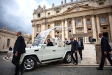Pope Francis gestures from the Pope mobile, as he attends the weekly general audience, in St. Peter's Square at the Vatican, April 24, 2024.