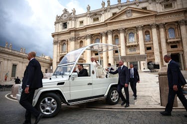 Pope Francis gestures from the Pope mobile, as he attends the weekly general audience, in St. Peter's Square at the Vatican, April 24, 2024.
