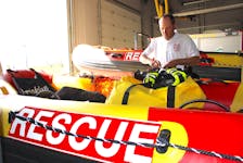 Brooklyn Volunteer Fire Department Chief Brett Tetanish packs up some new gear the department recently received along with two rescue boats.  
Jason Malloy