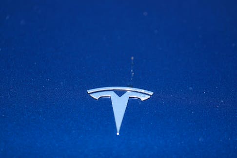The Tesla logo is seen on a car in Los Angeles, California, U.S., July 9, 2020. 