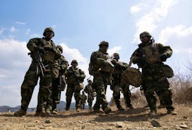 US soldiers from the 11th Engineer Battalion and 2nd Infantry Combined Division participate in the joint river-crossing exercise conducted for South Korean and US soldiers in Yeoncheon, Gyeonggi province, South Korea, 20 March 2024. JEON HEON-KYUN/Pool via