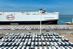 A drone view shows BYD electric vehicles (EV) before being loaded onto the "BYD Explorer No.1" roll-on, roll-off vehicle carrier for export to Brazil, at the port of Lianyungang in Jiangsu province, China April 25, 2024. China Daily via