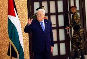 Palestinian President Mahmoud Abbas gestures, as he attends a swearing-in ceremony for the newly formed cabinet, in Ramallah, in the Israeli-occupied West Bank, March 31, 2024.
