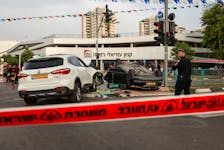 The car of Israel's National Security Minister Itamar Ben-Gvir is seen upturned after an accident near the area where a suspected stabbing incident took place, after he visited the scene, in Ramle, Israel April 26, 2024