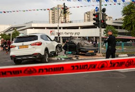 The car of Israel's National Security Minister Itamar Ben-Gvir is seen upturned after an accident near the area where a suspected stabbing incident took place, after he visited the scene, in Ramle, Israel April 26, 2024