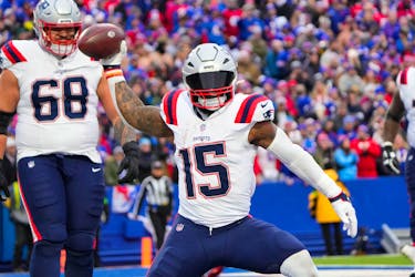 Dec 31, 2023; Orchard Park, New York, USA; New England Patriots running back Ezekiel Elliott (15) spikes the ball after scoring a touchdown against the Buffalo Bills during the second half at Highmark Stadium. Mandatory Credit: Gregory Fisher-USA TODAY Sports/ File Photo
