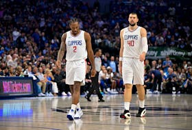 Apr 26, 2024; Dallas, Texas, USA; LA Clippers forward Kawhi Leonard (2) and center Ivica Zubac (40) walk back up the court during the fourth quarter against the Dallas Mavericks during game three of the first round for the 2024 NBA playoffs at the American Airlines Center. Mandatory Credit: Jerome Miron-USA TODAY Sports