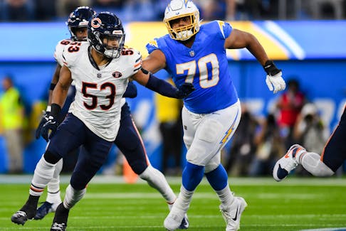 Oct 29, 2023; Inglewood, California, USA; Los Angeles Chargers offensive tackle Rashawn Slater (70) attempts to block Chicago Bears linebacker T.J. Edwards (53) during the second quarter at SoFi Stadium. Mandatory Credit: Jonathan Hui-USA TODAY Sports/ File Photo