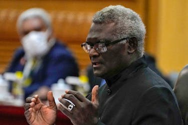 Solomon Islands Prime Minister Manasseh Sogavare speaks during a bilateral meeting with his Chinese counterpart Li Qiang at the Great Hall of the People in Beijing, Monday, July 10, 2023. Andy Wong/Pool via
