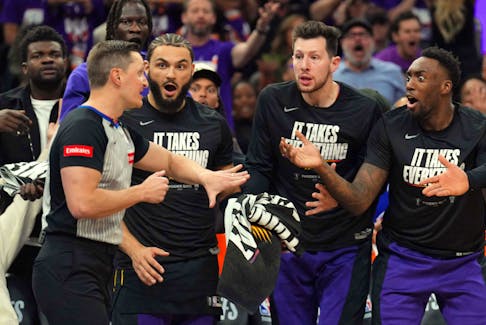 Apr 26, 2024; Phoenix, Arizona, USA; Phoenix Suns bench players react toward referee JB DeRosa (22) during the first half of game three of the first round for the 2024 NBA playoffs against the Minnesota Timberwolves at Footprint Center. Mandatory Credit: Joe Camporeale-USA TODAY Sports