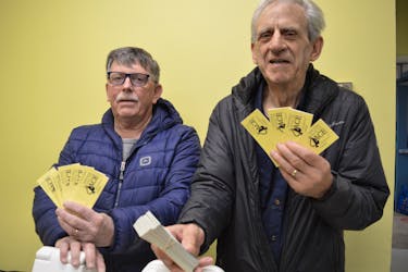 Northside 4 Chase the Ace chair Craig Ivey, left, and North Sydney Food Bank executive director Lawrence Shebib. The draw is down to the last three cards this week. BARB SWEET/CAPE BRETON POST