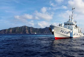 Japan Coast Guard vessel PS206 Houou sails in front of Uotsuri island, one of the disputed islands, called Senkaku in Japan and Diaoyu in China, in the East China Sea August 18, 2013.