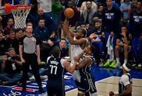 Apr 26, 2024; Dallas, Texas, USA; LA Clippers forward Kawhi Leonard (2) shoots the ball over Dallas Mavericks guard Luka Doncic (77) during the first quarter during game three of the first round for the 2024 NBA playoffs at the American Airlines Center. Mandatory Credit: Jerome Miron-USA TODAY Sports