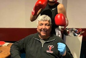 Aleah Young of Eskasoni, 16, stands behind her boxing coach Barry Bernard. Bernard, Young and three other fighters from Red Tribe Boxing are heading to Las Vegas, Nevada to compete at the 2024 Box Fan Expo. CONTRIBUTED
