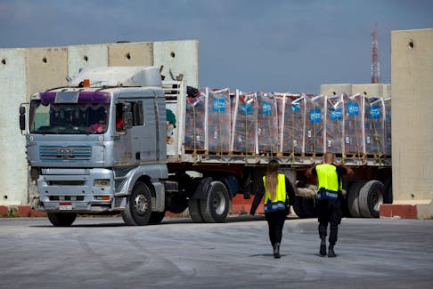 A truck carrying humanitarian aid bound for the Gaza Strip drives at the inspection area at the Kerem Shalom crossing, amid the ongoing conflict between Israel and the Palestinian Islamist group Hamas, in southern Israel, March 14, 2024.