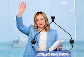 Italy's Prime Minister Giorgia Meloni gestures at a "Brothers of Italy" (Fratelli d'Italia) right-wing party conference in Pescara, Italy, April 28, 2024.