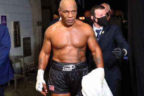 Mike Tyson exits the ring after receiving a split draw against Roy Jones Jr. in 2020.