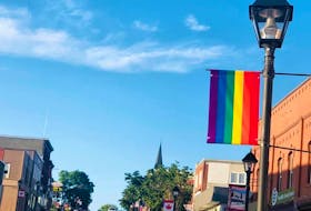 A new town policy no longer allows Pride banners on light poles in downtown Woodstock.