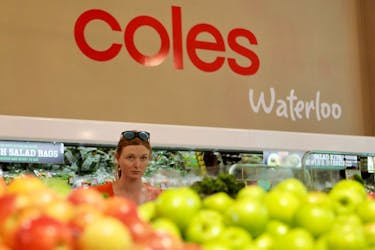 A woman walks in the fruit and vegetables section at a Coles supermarket in Sydney, Australia, February 20, 2018. Picture taken February 20, 2018.