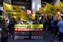 A group of protesters hold yellow flags with the word Khalistan, as well as a banner with the picture of Sikh separatist leader Hardeep Singh, during a protest outside India's consulate, a week after Canada's Prime Minister Justin Trudeau raised the prospect of New Delhi's involvement in the murder of Sikh separatist leader Hardeep Singh Nijjar in British Columbia, in Toronto, Ontario, Canada September 25, 2023.