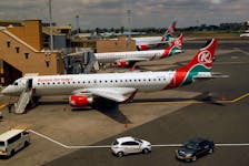 Kenya Airways planes are seen through a window at the Jomo Kenyatta international airport in Nairobi, Kenya August 1, 2020.