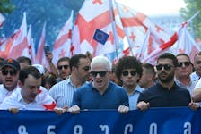 Tsotne Ivanishvili (C), son of billionaire ex-prime minister Bidzina Ivanishvili, takes part in a pro-government rally in support of a bill on "foreign agents" in Tbilisi, Georgia April 29, 2024.