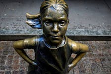 The Fearless Girl statue is seen outside of the New York Stock Exchange (NYSE) in New York City, U.S., November 29, 2021. 