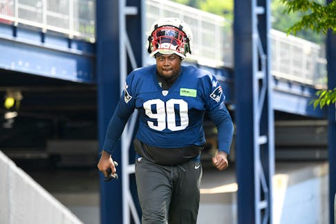Jul 30, 2022; Foxborough, MA, USA; New England Patriots defensive end Christian Barmore (90) walks to the practice field at the Patriots training camp at Gillette Stadium. Mandatory Credit: Eric Canha-USA TODAY Sports/ FILE PHOTO