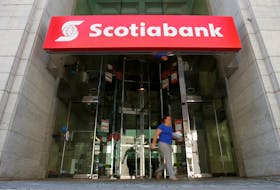 A woman leaves a Scotiabank branch in Ottawa, Ontario, Canada, May 31, 2016.
