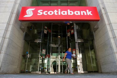 A woman leaves a Scotiabank branch in Ottawa, Ontario, Canada, May 31, 2016.