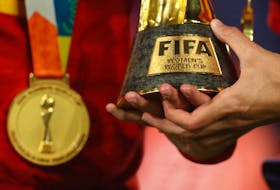 Soccer Football - FIFA Women's World Cup Australia and New Zealand 2023 - Final - Spain v England - Stadium Australia, Sydney, Australia - August 20, 2023 General view of a Spain player holding the World Cup trophy after the match