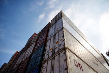Shipping containers are stacked at Pusan Newport Terminal in Busan, South Korea, July 1, 2021.