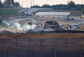 Israeli soldiers and Palestinian protesters clash near the border between Israel and the Gaza Strip as seen from the Israeli side, September 23, 2023.