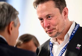 Tesla, X (formerly known as Twitter) and SpaceX's CEO Elon Musk speaks with other delegates on Day 1 of the AI Safety Summit at Bletchley Park in Bletchley, Britain on November 1, 2023. Leon Neal/Pool via
