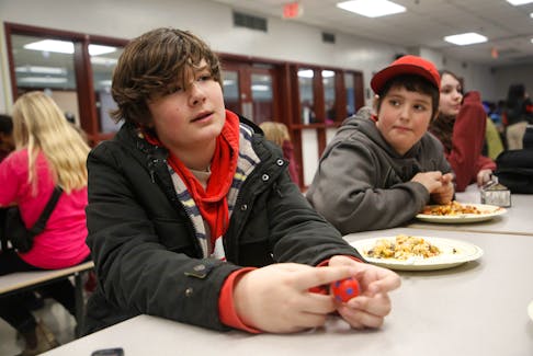 Grade 8 student Tyson Croft said his butter chicken lunch was like a party in his mouth. He says his school always has delicious food on the lunch menu.

TIM KROCHAK PHOTO