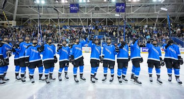 Toronto players salute the crowd after the inaugural PWHL hockey game against New York.