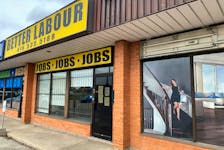 A view of an illustration outside a wood flooring sales office next to an employment agency in Toronto, Ontario, Canada October 8, 2021.