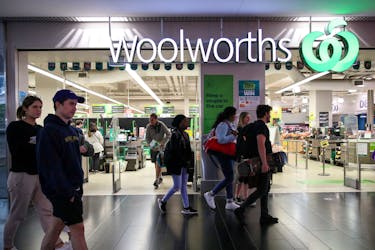 People walk past a Woolworths supermarket in Sydney, Australia, June 16, 2020. 